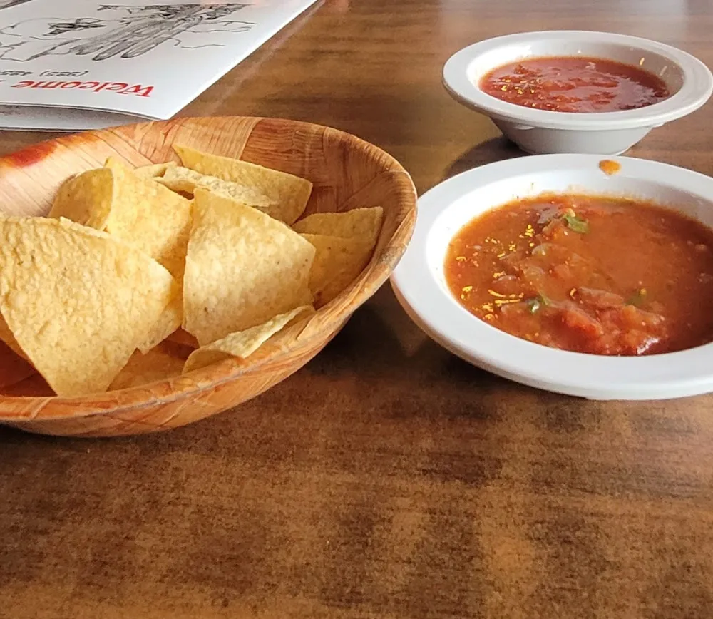 Tortilla Chips and One Mild and One Hot Salsa